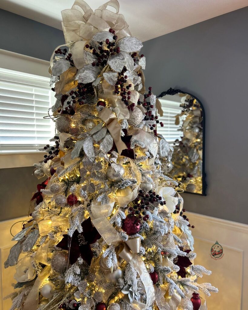 A Christmas tree that is fully decorated.