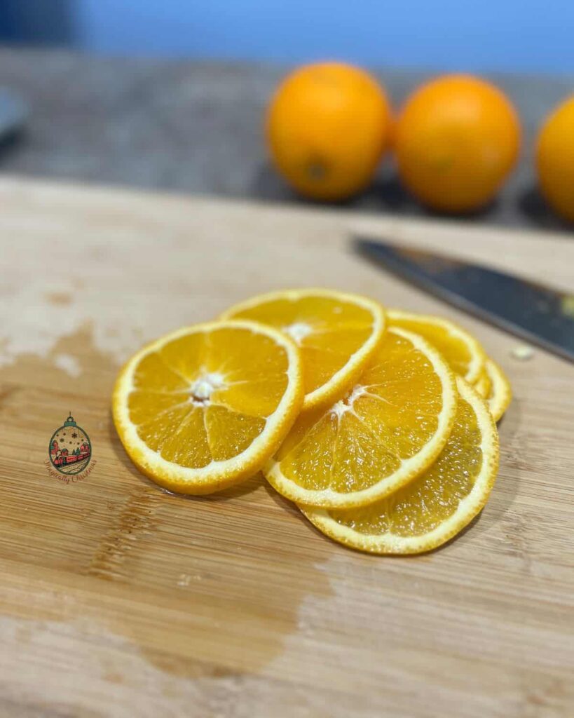 Fresh slices of oranges that will be dried in the oven to use fro Christmas villages.