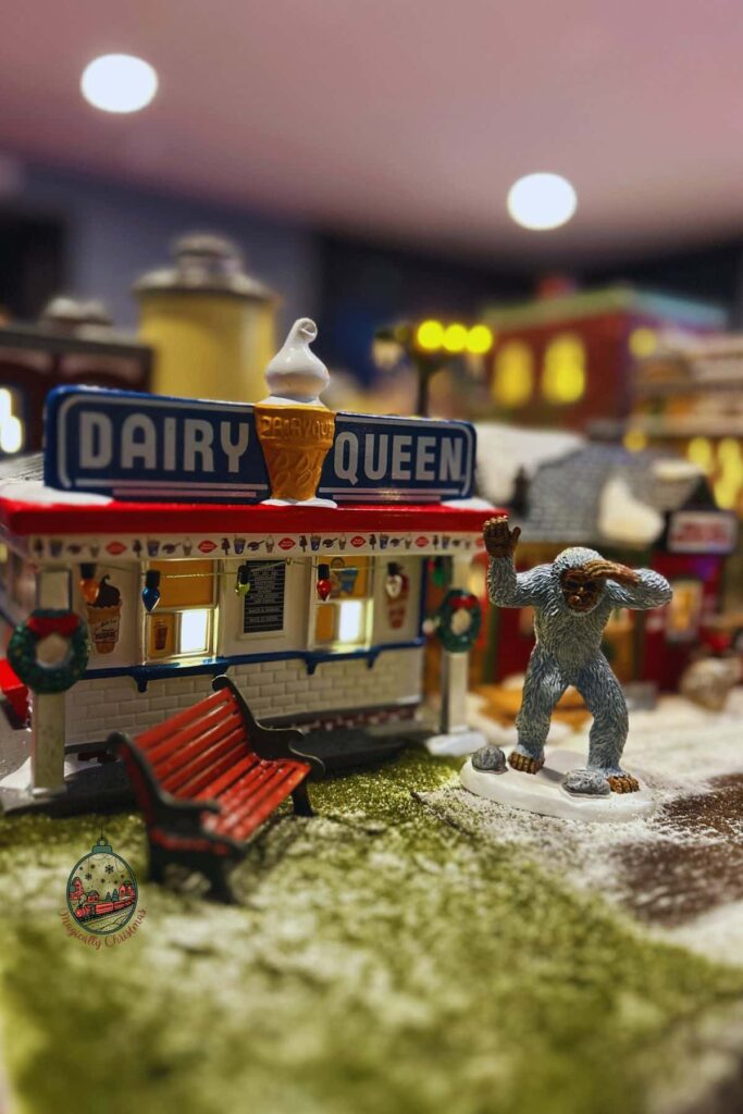 Yeti standing outside of the Dairy Queen in Frosty Falls Christmas village.