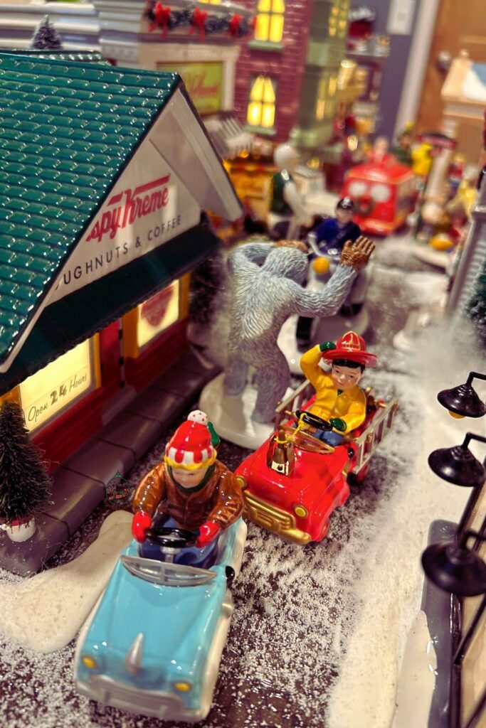 Department 56 buildings and people up close that make up the Christmas village.